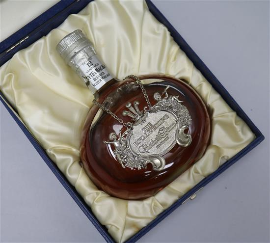 A bottle of Whyte and Mackay deluxe whisky